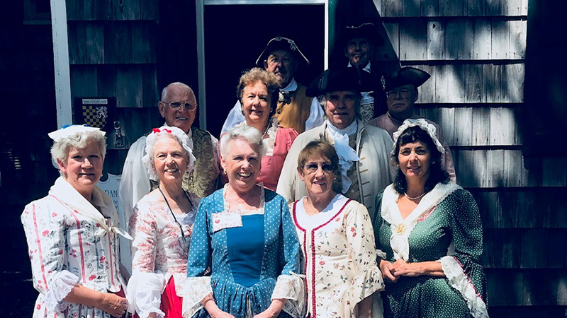 Dancers dressed in colonial period garb